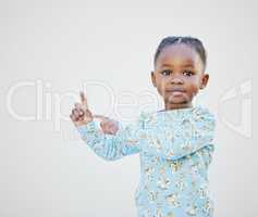 Think Im cute Check this out. an adorable little girl standing against a white background.