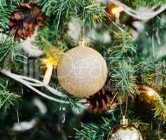 Its almost Christmas time. Closeup shot of a bauble hanging on a Christmas tree.