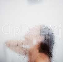 I may have spent too long in here. a woman enjoying a shower at home.
