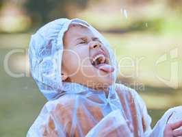 I wonder what rain tastes like. a little girl sticking her tongue out to catch the rain drops in her mouth.