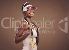 Time to get some cardio in. an attractive young woman standing alone in the studio and posing with a skipping rope before working out.