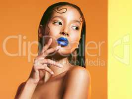 Nobodys opinion but yours should matter. Studio shot of a beautiful young woman wearing blue lipstick.