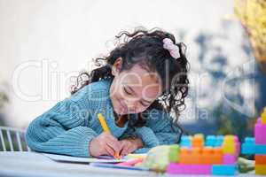 I love putting bright colours on a page. a little girl completing homework in her yard.