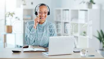 Happy call center agent calling, talking and doing online sales with a laptop and modern headset inside a company office. Smiling ecommerce consultant promoting services in telemarketing company