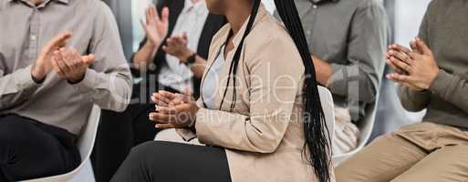 So hard to find unopened doors. a group of unrecognizable businesspeople clapping during a conference in a modern office.