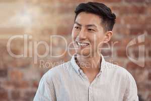 Happy, confident and smiling business man looking thoughtful while working in a creative startup agency. Cheerful, charming and positive designer feeling ambitious, optimistic and ready for work