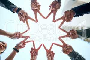 Never forget that youre a star. a group of unrecognizable businesspeople making a star shape with their hands.