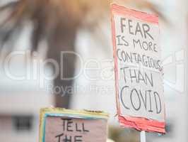 Fear results in control. Cape Town, South African - October 2, 2021 Unrecognisable demonstrators holding up signs and protesting against the Covid 19 vaccine.