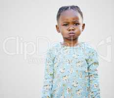 Mom said that Ill be on the naughty list this year. an adorable little girl standing against a white background.