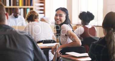 I cant wait to learn something new. Portrait of a teenage girl in a classroom at high school.