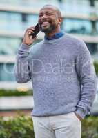 Thanks for calling. a handsome mature businessman making a phonecall while out in the city.