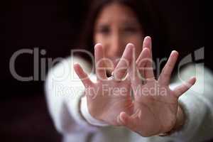 Please dont hurt me. a young woman looking distressed and reading out her hand.