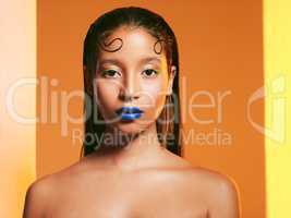 Basic Nah, Im extra. Studio shot of a beautiful young woman wearing blue lipstick.