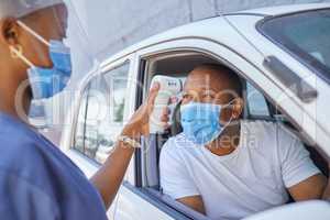 Drive thru for covid screening or testing service for people driving or traveling. Black man wearing a mask in a car getting his temperature test using an infrared thermometer as coronavirus protocol