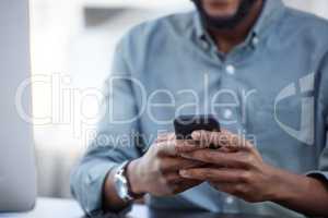 f you want to achieve excellence, you can get there. a unrecognizable male using a phone at work in a modern office.