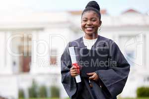 All my effort during all these years were worth it. Portrait of a young woman holding a certificate and cap on graduation day.