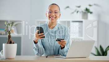 Businesswoman, finance advisor and executive shopping online with a phone and credit card in an office. Happy, smiling and cheerful trader banking with ecommerce internet payment while spending money