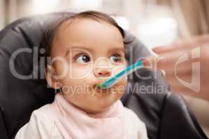 Did you taste this. an adorable baby girl eating her food.