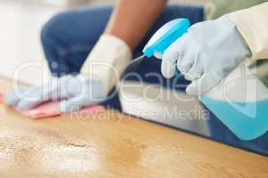 Clean surfaces mean a healthy body. a man cleaning a table.
