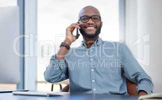 Courage is resistance to fear. a young businessman using a smartphone in a modern office.