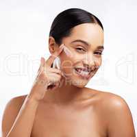 Keep your skin hydrated and fresh on the daily. Studio portrait of a beautiful young woman applying moisturiser to her face against a white background.