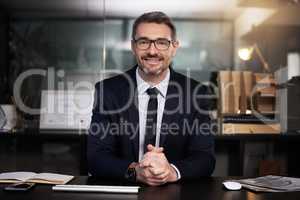 I took the leap, now Im the owner of a successful business. Portrait of a mature businessman sitting at his desk.