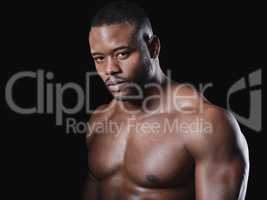 Leave nothing untouched. Studio portrait of a fit young man posing against a black background.