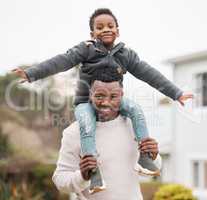 Dad will always be there to lift him up. Portrait of a father and his son having fun while bonding together outdoors.