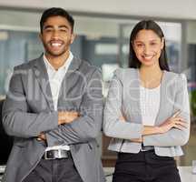 We wont settle for average. Portrait of a young businessman and businesswoman working in a modern office.