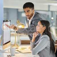 One small contribution can make a big difference. a young businessman and businesswoman using a computer in a modern office.