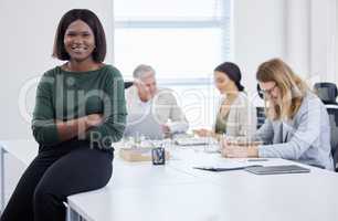 Boss up, your business needs you. Portrait of a young businesswoman having a meeting in a modern office.