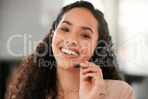 Id be happy to help. a young female call center agent in an office at work.