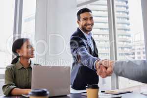 Ready to bring big changes. two business people shaking hands during a meeting.