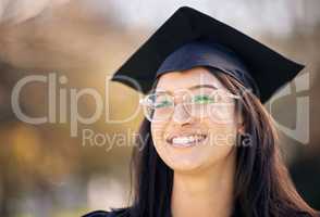 To achieve, we first have to believe. a happy young woman celebrating graduation day.