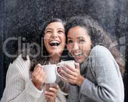 My idea of Christmas, whether old-fashioned or modern, is very simple loving others. two young women drinking coffee in the snow outside.