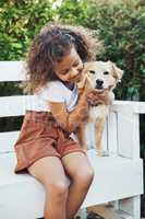 Ive been wanting a puppy for ages. a little girl spending time with her pet dog.