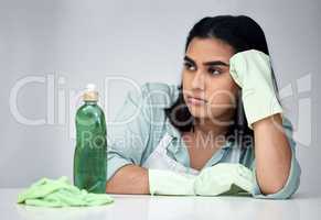 I cant believe they sent the wrong products. a young woman looking angry while cleaning.