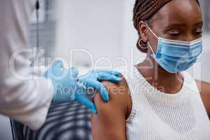 You might have a sore arm. a young child receiving her covid vaccination.