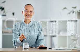 Woman counting and saving money in a cash jar to create a budget for a financial investment with her bank. Lady making finance a priority after getting smart credit advice from a financial advisor