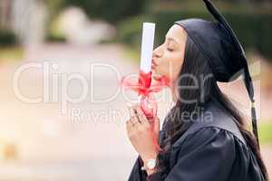 Dreams dont work unless you do. an attractive young female student celebrating on graduation day.