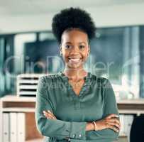 The best is yet to come. Portrait of a confident young businesswoman standing in an office.