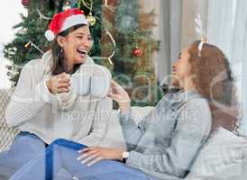 Cheers to us. two young women drinking coffee at home.