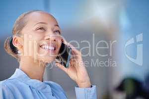Closeup of a happy and beautiful smiling businesswoman while on the phone. Female adult manager making answering call in mobile roaming, lady having pleasant phone conversation with client