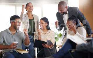 Yes. a diverse group of businesspeople cheering while sitting in the boardroom during a meeting.