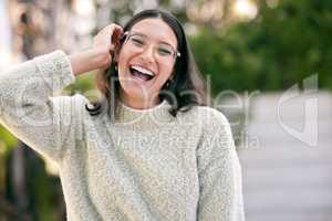 All I really want is a life full of love and laughter. a happy young woman standing outside.