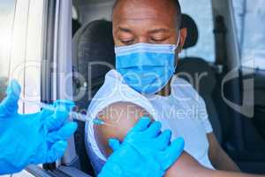 Covid, medical worker and vaccine site and service for patient getting flu shot or dose for coronavirus prevention. Man in car wearing protective face mask to avoid contact while getting an injection