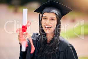 Let the celebrations begin. Cropped portrait of an attractive young female student celebrating on graduation day.