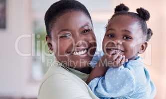 Family love is never broken. a young mother holding her daughter at home.