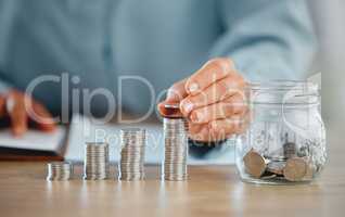 Hands holding coin pile to make a finance budget and successful financial choices. Closeup of money management and saving success. Stacked savings for the future, investment and retirement