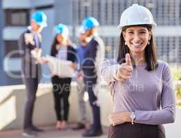 Youre going to love your new building. a young businesswoman standing in the city and showing a thumbs up gesture while wearing a hardhat.